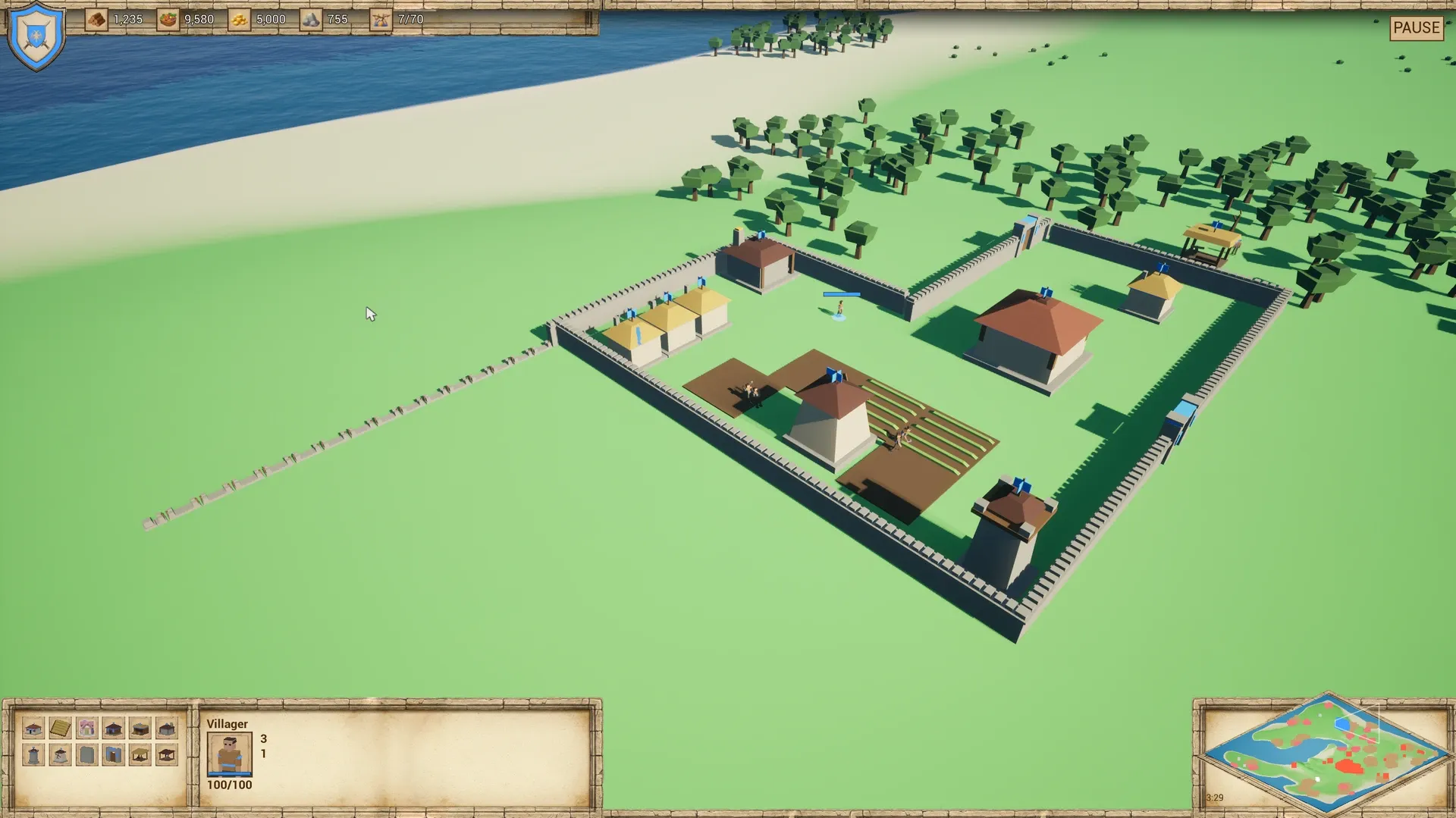 A long new wall run branching off the corner of the village wall across open grass. Its pieces are low foundations, while the finished wall ring behind has full-height crenellated pieces, corners and gates.